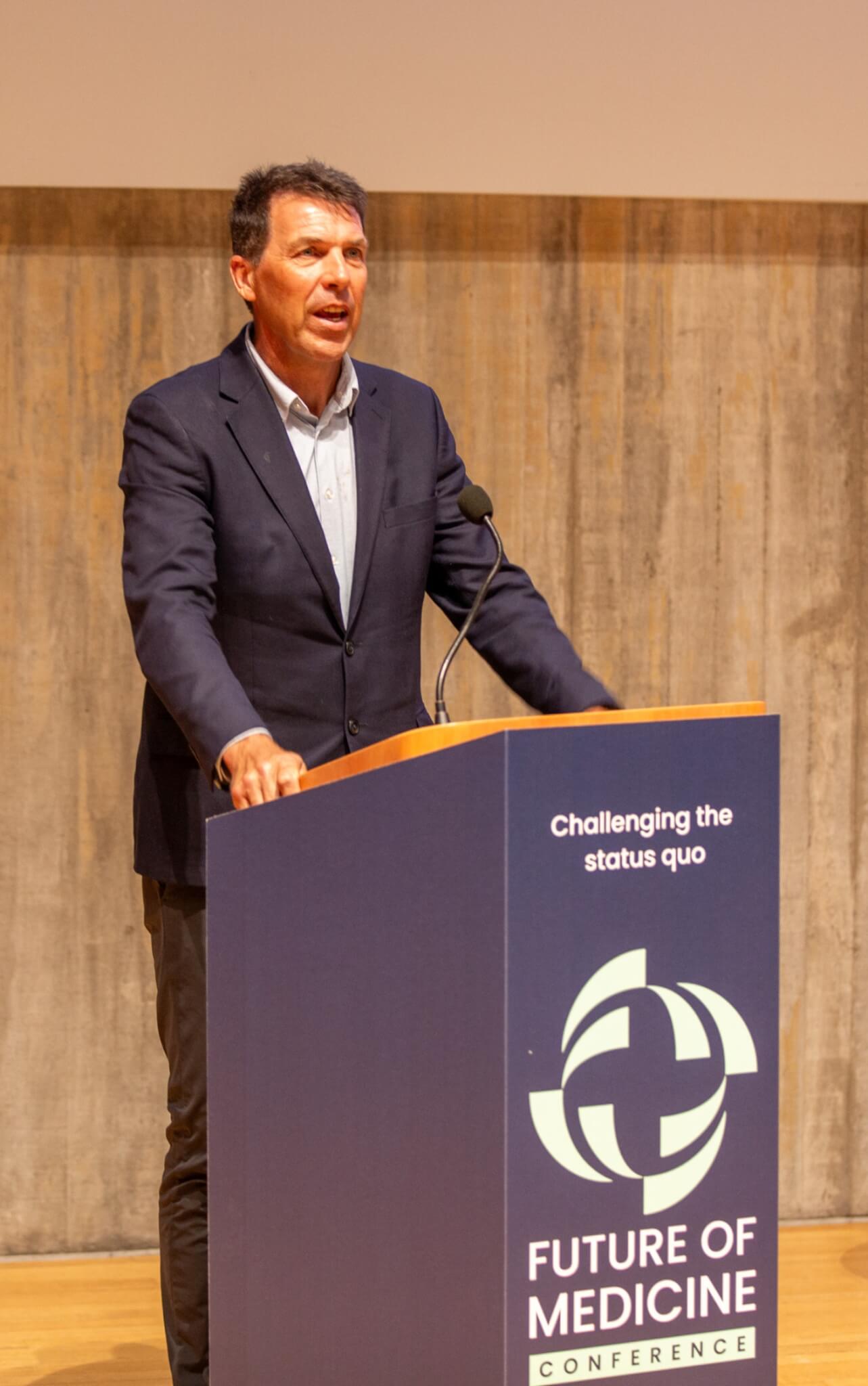 Professor Grant Schofield speaking on stage